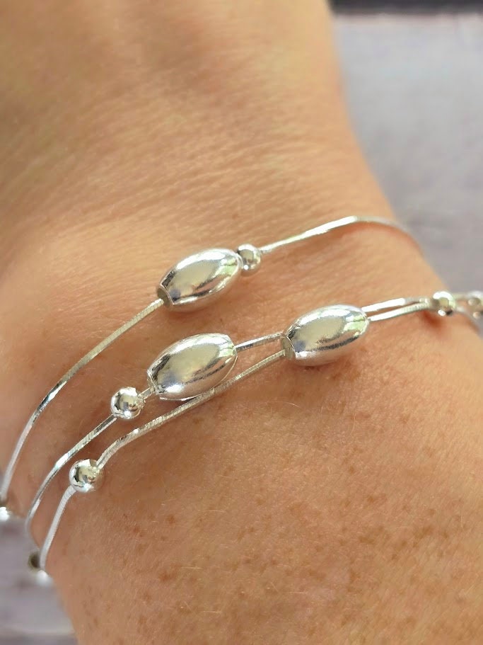 Sterling silver oval bead bracelet, Moving bead bracelet, Silver bead bracelet, Statement jewellery, Elegant jewellery.