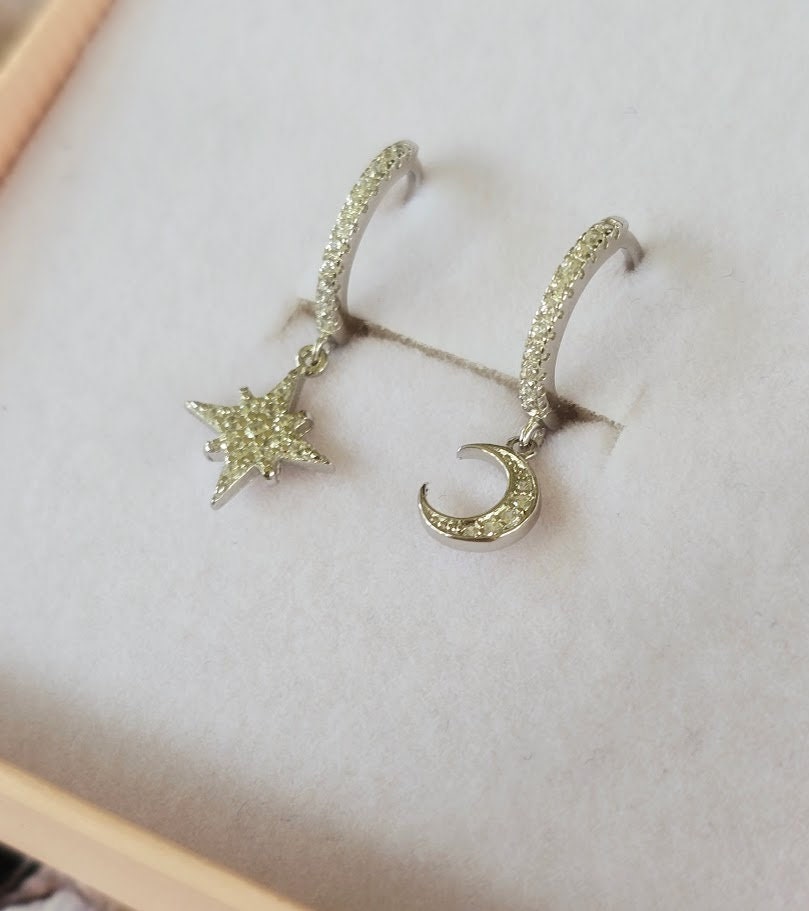 Dainty moon and star asymmetric huggie hoops, cubic zirconia moon and star hoops, sparkly hoops, celestial jewellery, minimalist earrings.