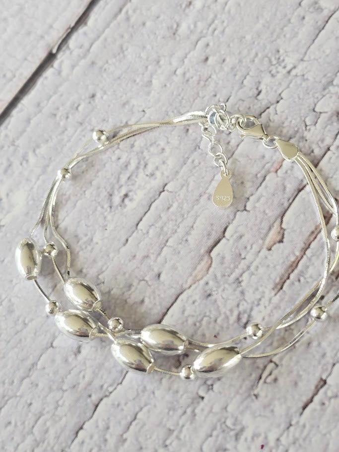 Sterling silver oval bead bracelet, Moving bead bracelet, Silver bead bracelet, Statement jewellery, Elegant jewellery.