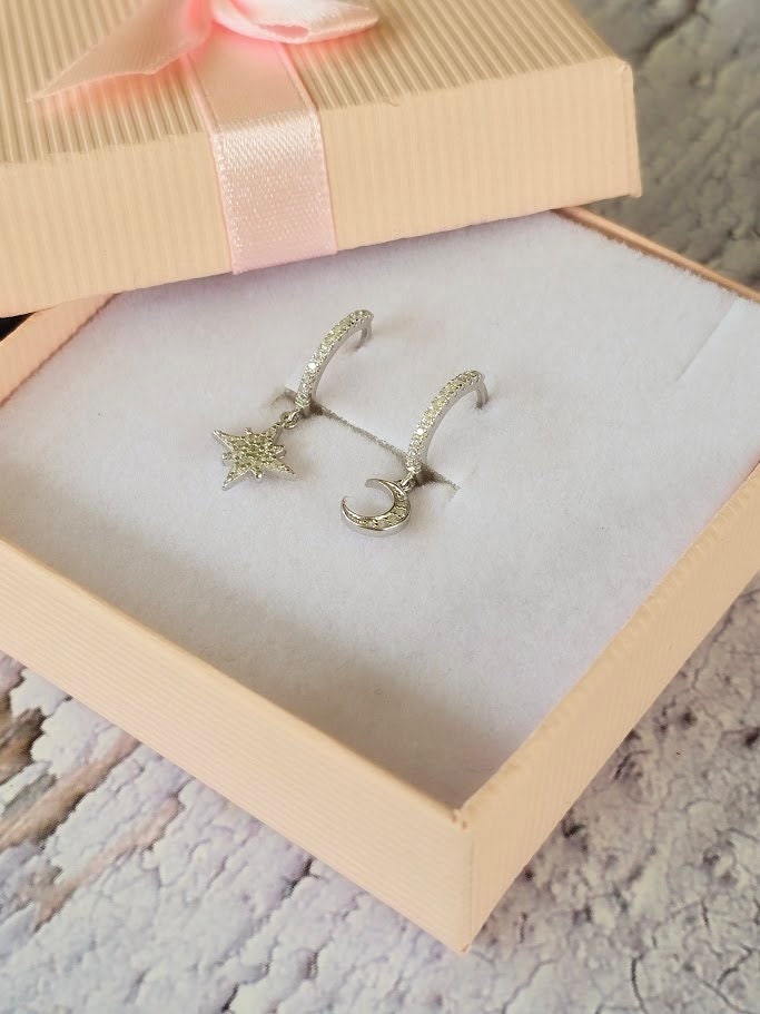 Dainty moon and star asymmetric huggie hoops, cubic zirconia moon and star hoops, sparkly hoops, celestial jewellery, minimalist earrings.
