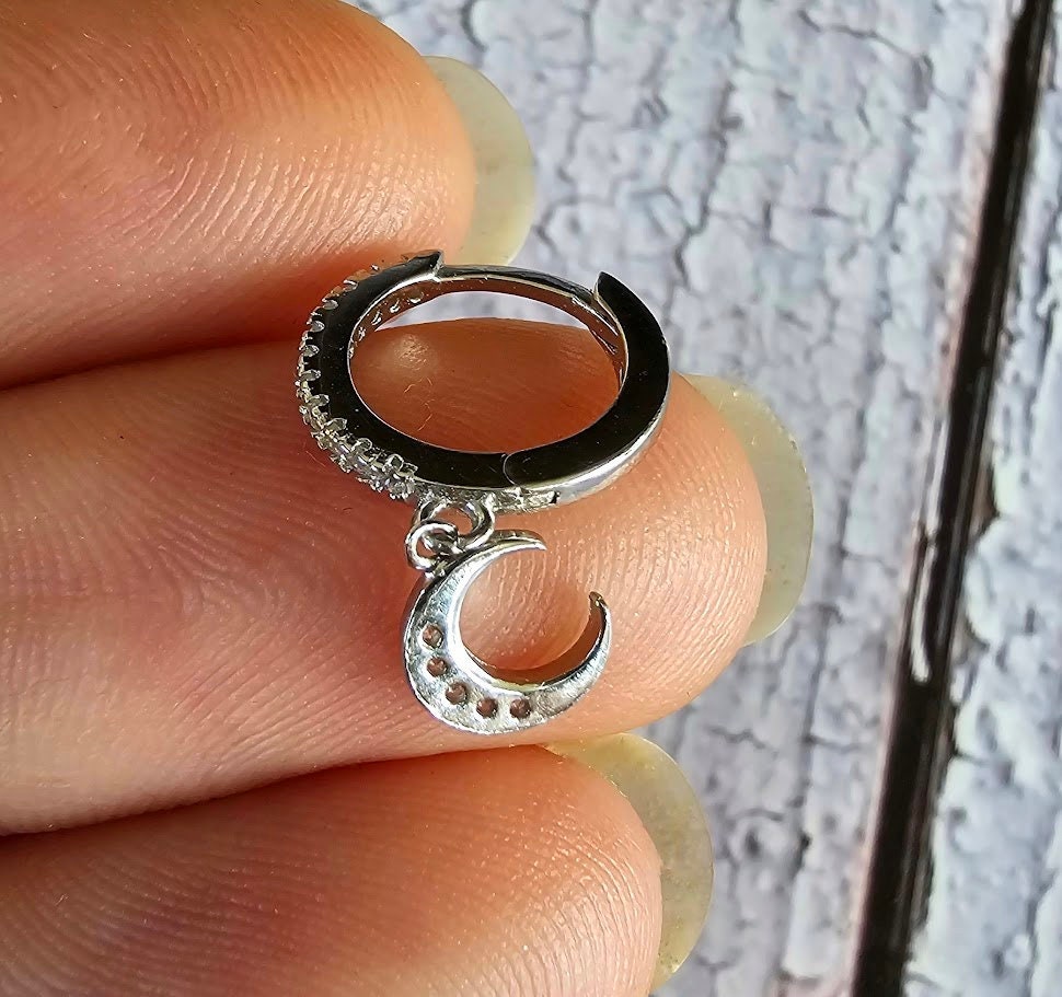 Dainty moon and star asymmetric huggie hoops, cubic zirconia moon and star hoops, sparkly hoops, celestial jewellery, minimalist earrings.